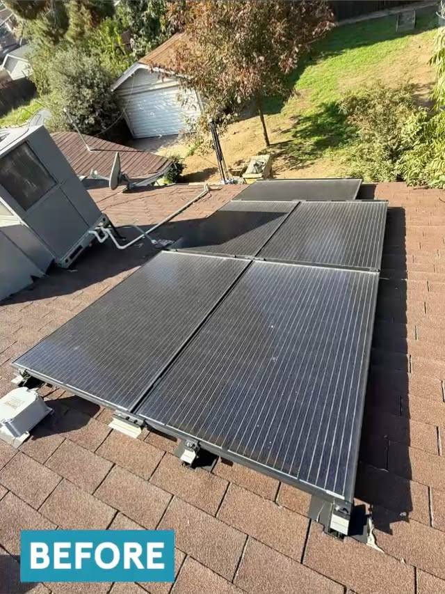 Rooftop solar panels covered in dust and grime before cleaning